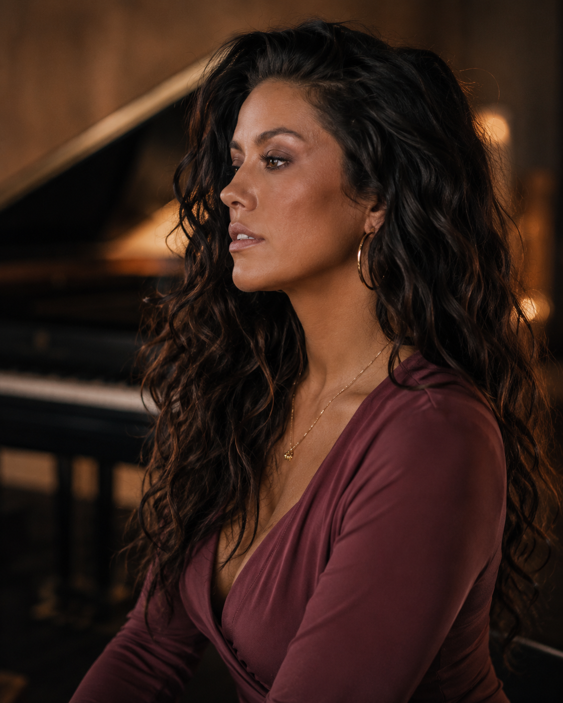 Maya Reeve in profile beside a piano